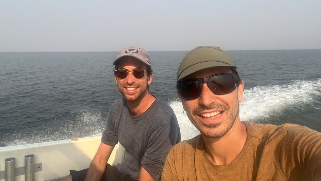 Gaspard and javi on the resupply boat from musango