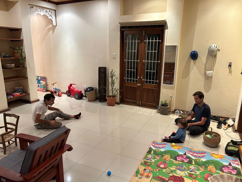 Javi and Gaspard playing with Lila the baby of our hosts 