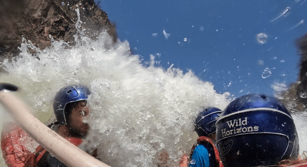 Three people doing rafting in the Victoria falls from the Zambezi side