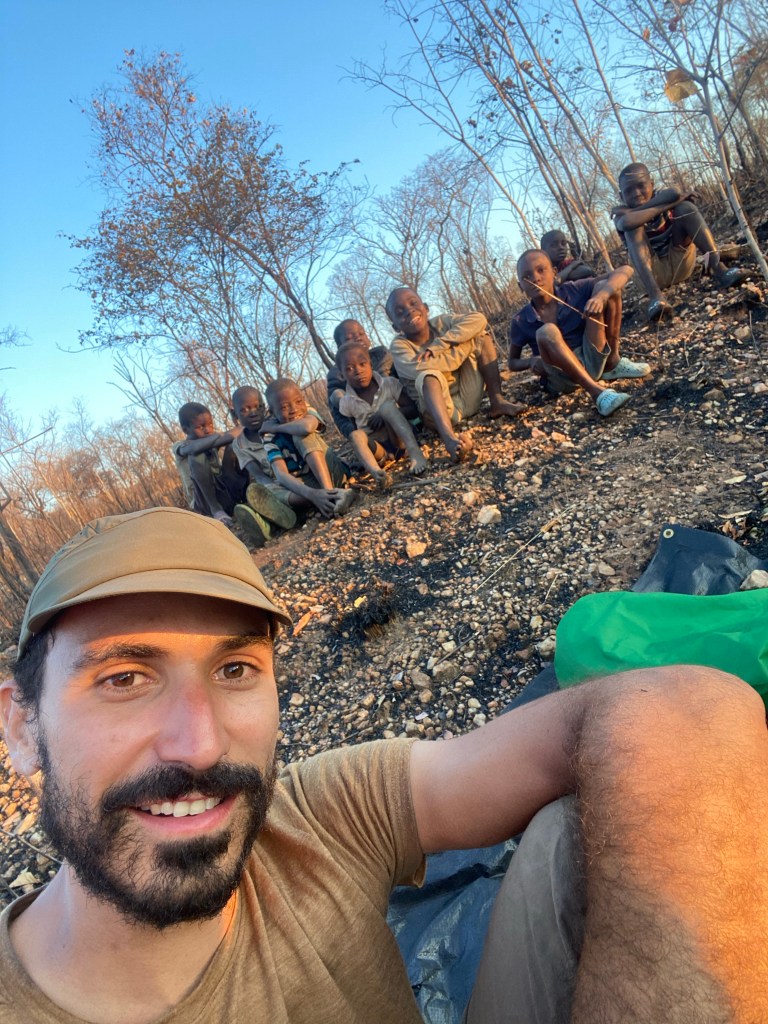 Javi with kids while we are biking in Zambia 