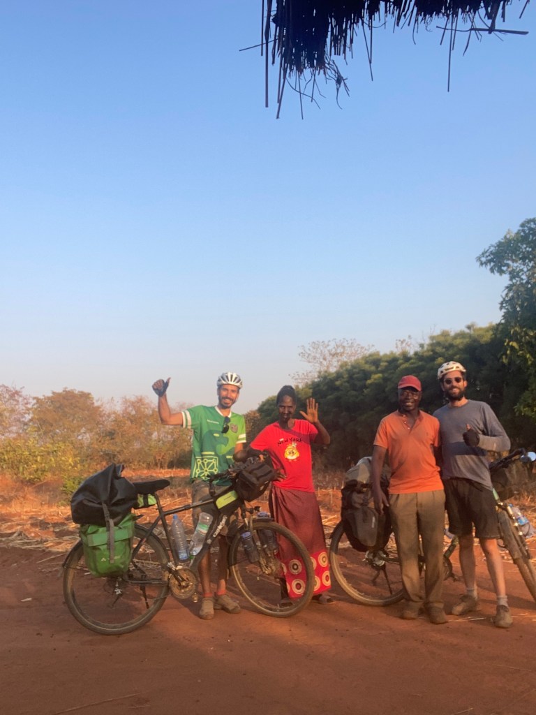 Prince his wife, us and our bicycle next to Lusaka 