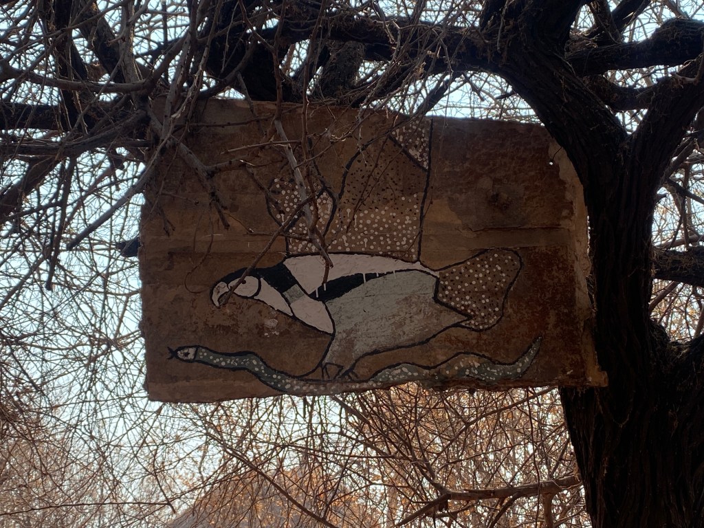 Art of a fish eagle catching a snake in a fisherman village in Zimbabwe