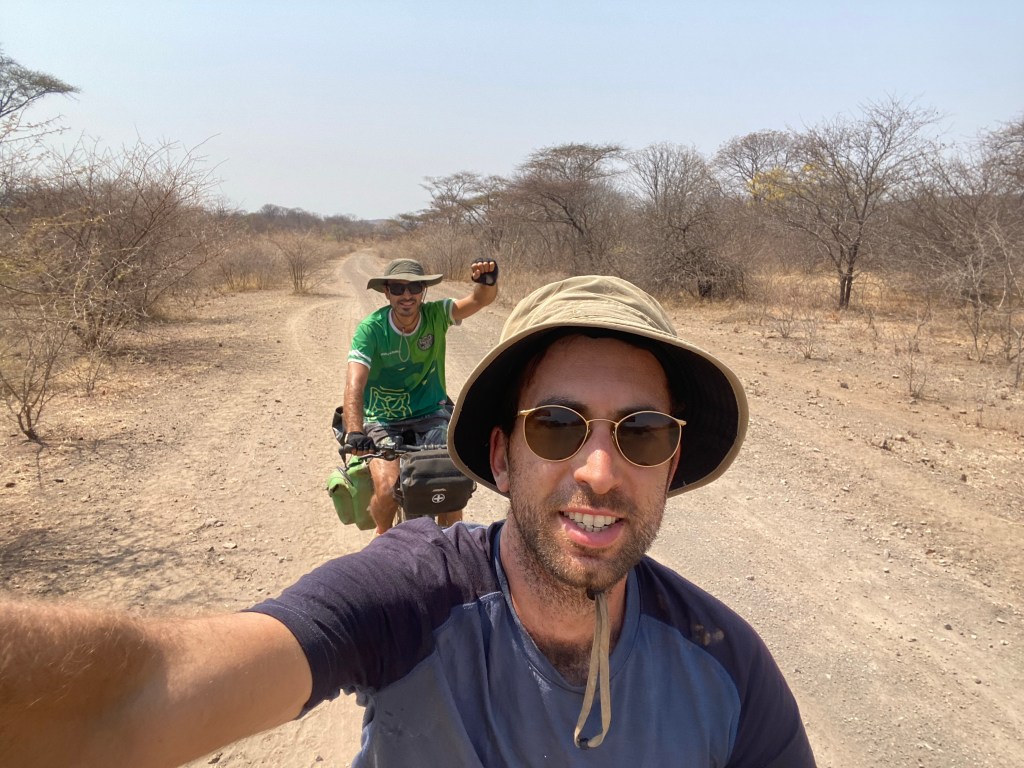 Two cyclist on a dirt road in Zimbabwe