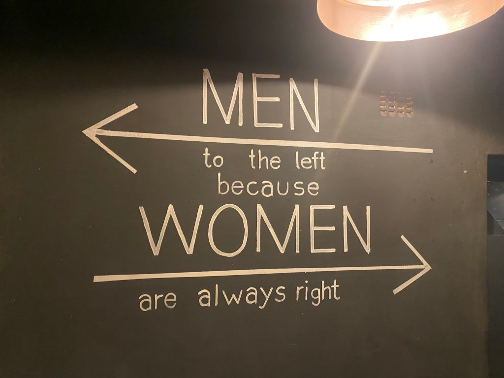 Toilet sign in a sport bar in Livingstone Zambia 