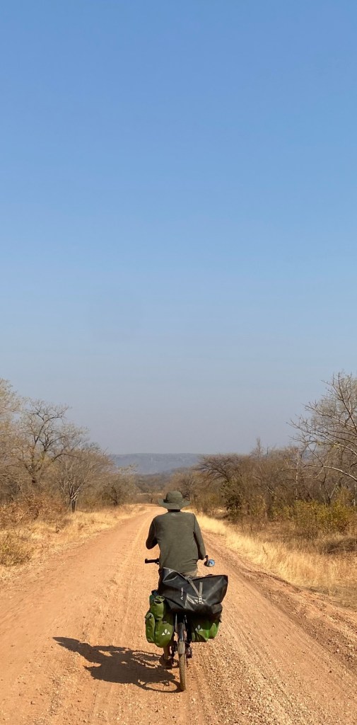 Cyclist on the road to Siabuwa Zimbabwe