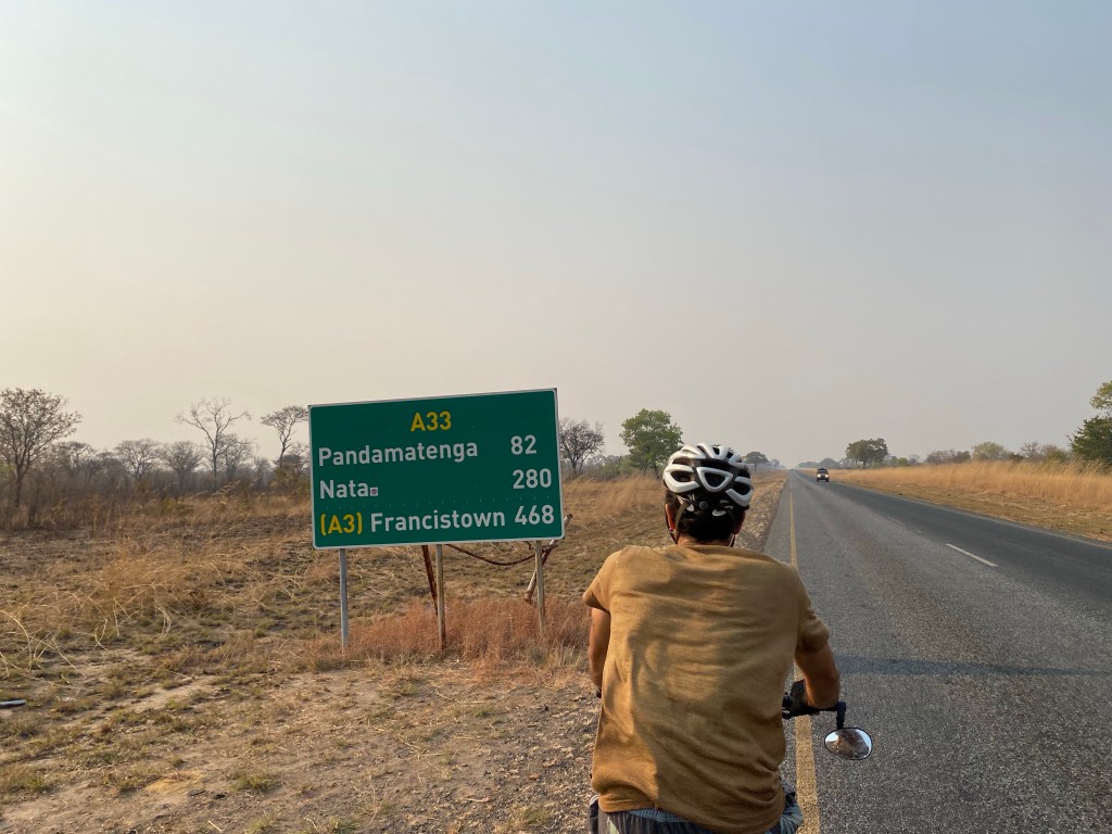 A cyclist with a sign Nata 280 km 