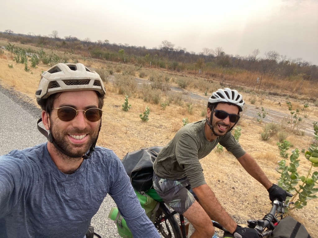 Two cyclists on elephant highway in Botswana 
