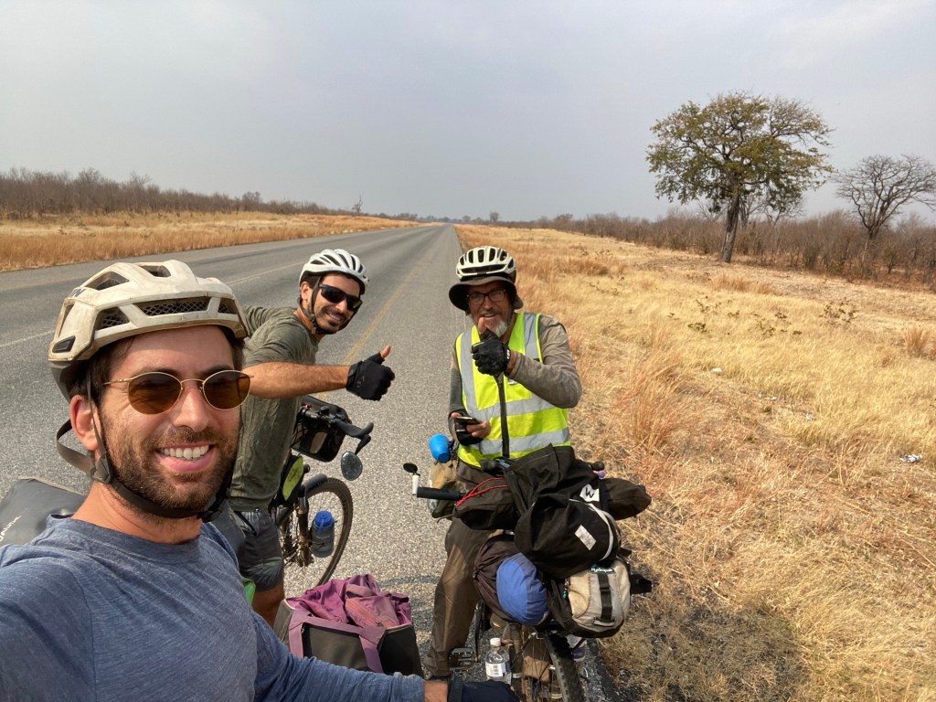 Three cyclotouristes meeting on the elephant highway in Botswana 
