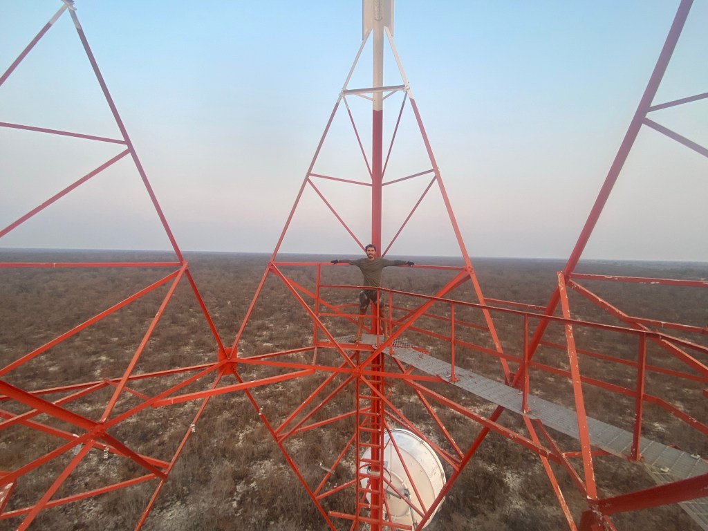 Cyclist inside a communication antenna in Botswana 