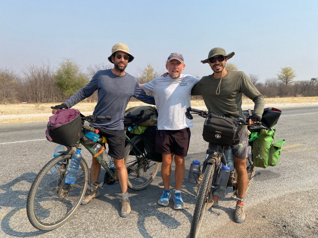 Two cyclist meeting Keith: a man running the cape to Cairo 