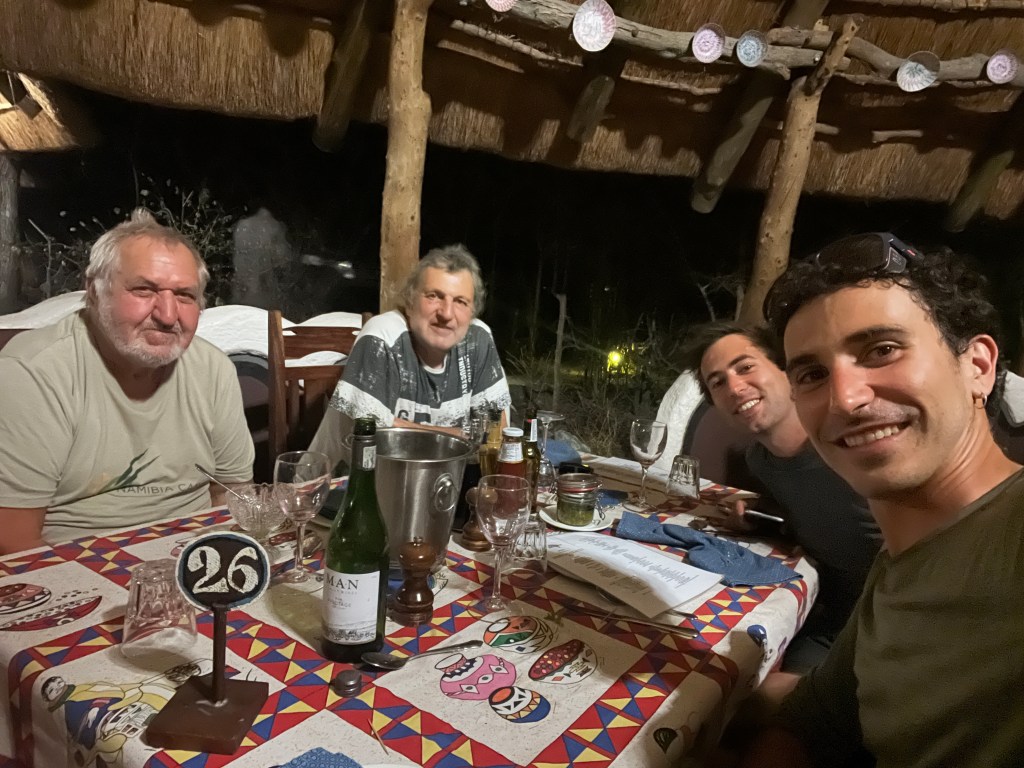Two cyclist having dinner with two Swiss men at planet baobab in Botswana