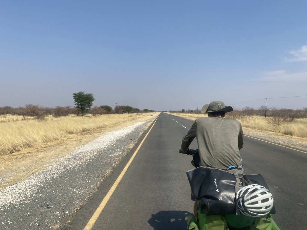 Cyclist on the road to gobabis in Namibia 