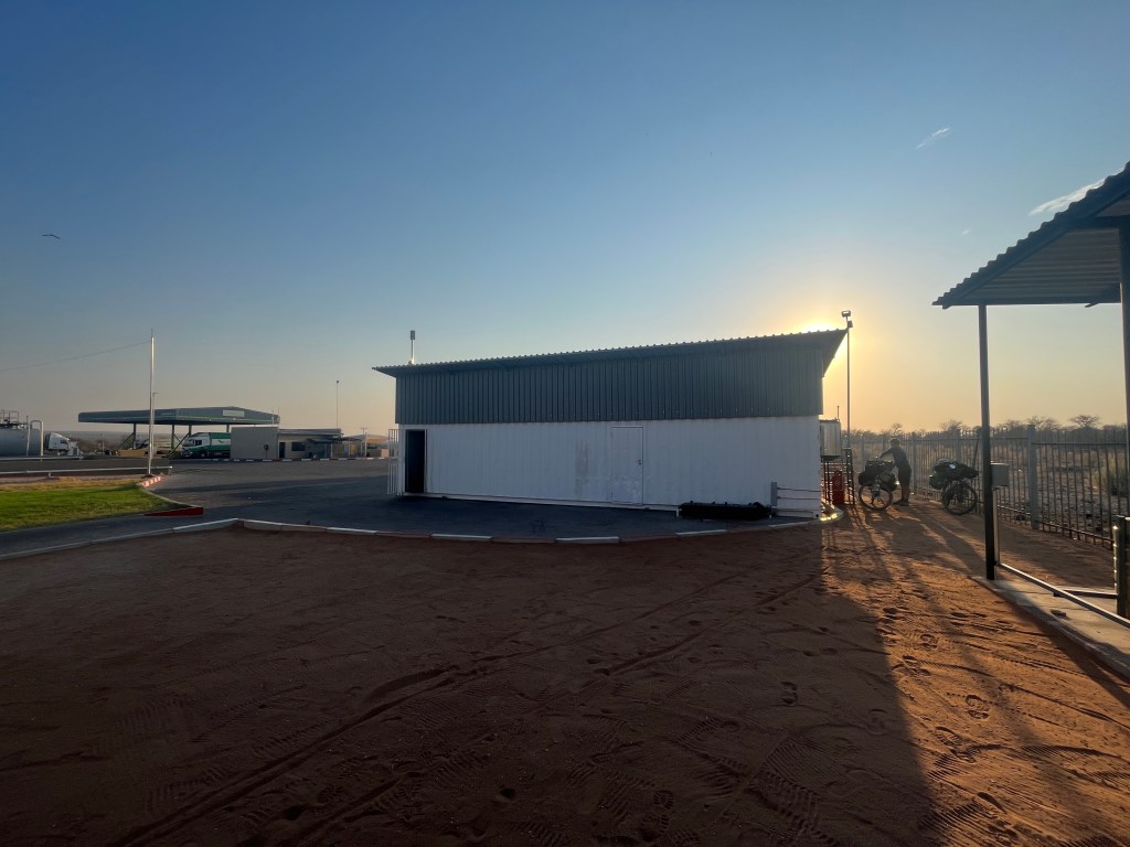 Cyclist hiding their tent in a truck filling station Botswana 