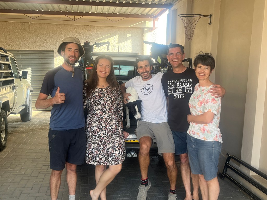 Two cyclist with their guest family from warm showers 